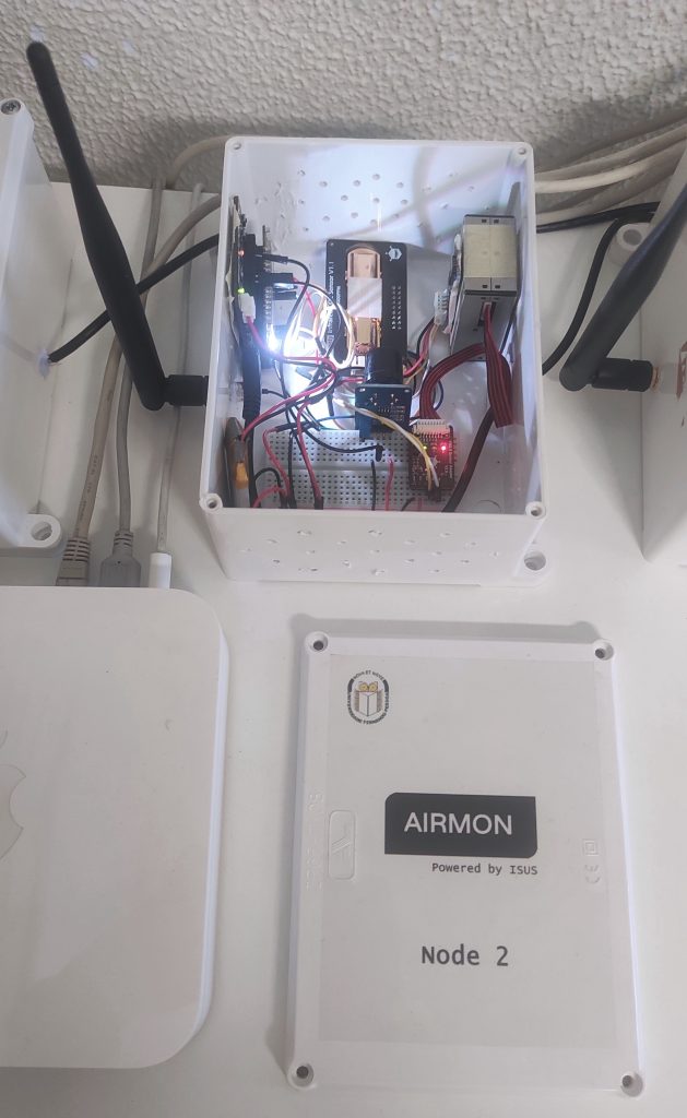 Open AIRMON node showing the electronics inside the enclosure