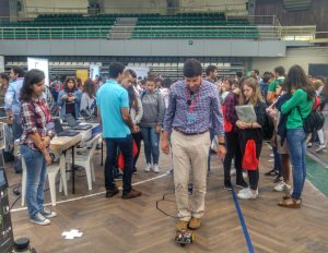 Visitors and researchers around a robot at the European Researchers’ Night