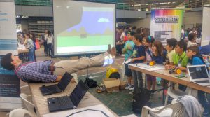 ISUS stand with laptops and visitors at the event