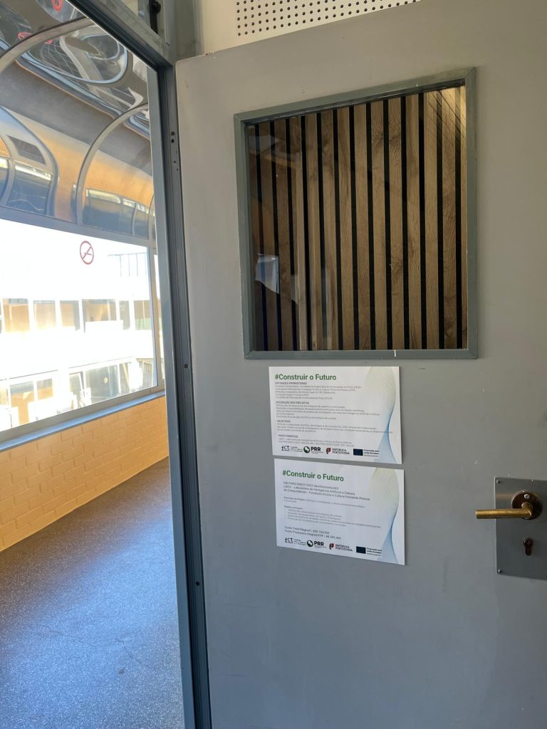 Office door next to a window, with PRR funding notices