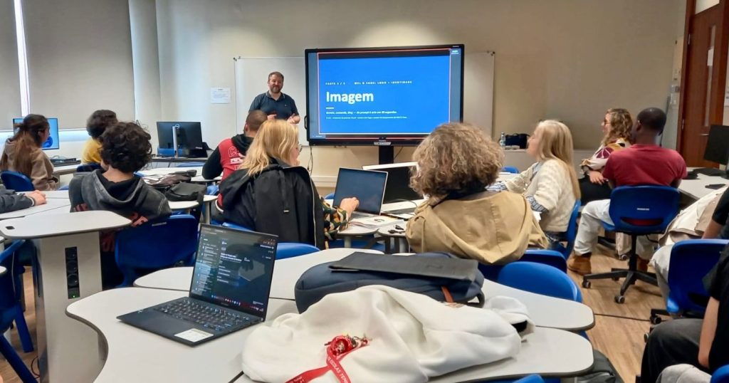 Prof. Christophe Soares presenting a workshop to students seated at computers